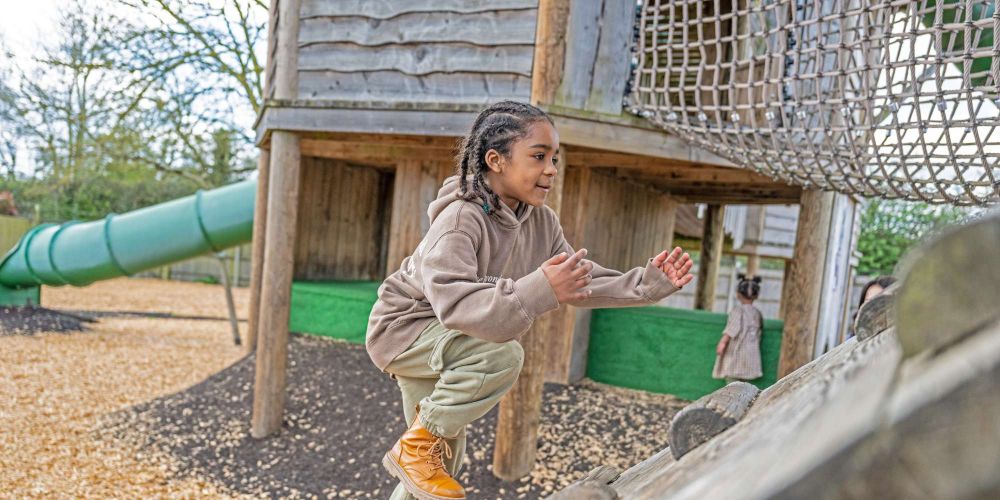 Boy climbing outside