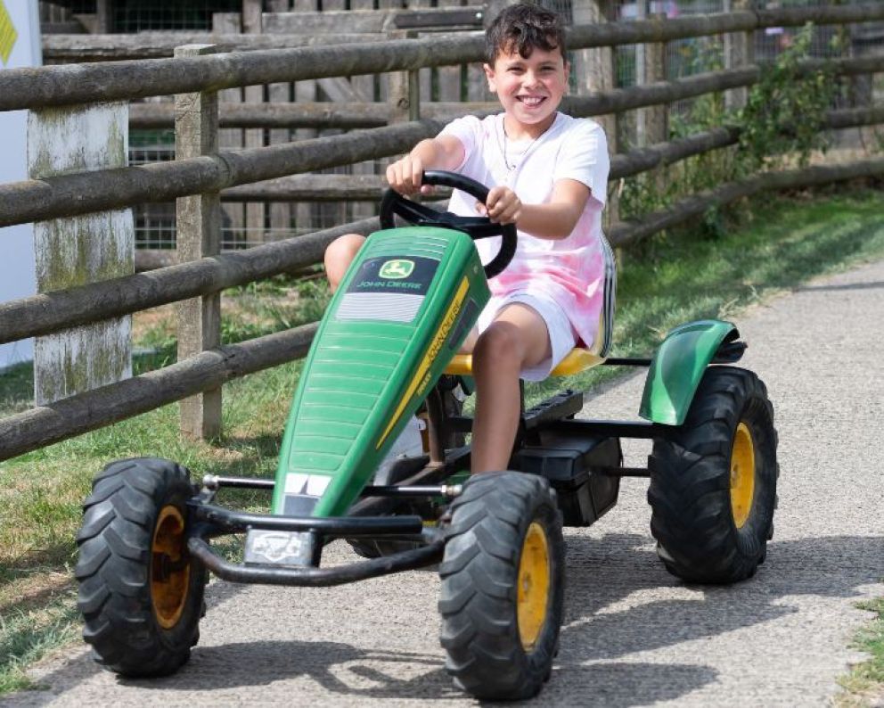 Boy on John Deer Go Kart